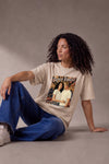 Woman wearing a custom cream relaxed tee with a portrait print