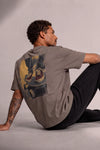Man wearing a custom gray boxy tee with a printed design