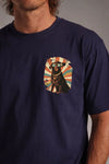 Man wearing a custom navy boxy tee with a chest print