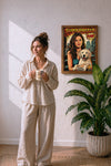 Woman holding a custom photo mug beside a personalized pet poster in a styled living room