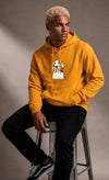 Man wearing a custom mustard yellow hoodie with a printed design
