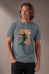 Man wearing a custom blue tee with a printed design