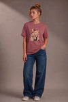 Woman wearing a custom faded maroon tee with a pet design