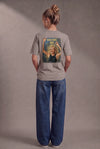 Woman wearing a custom faded gray tee with a printed design