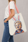Person carrying a custom printed canvas tote bag over the shoulder