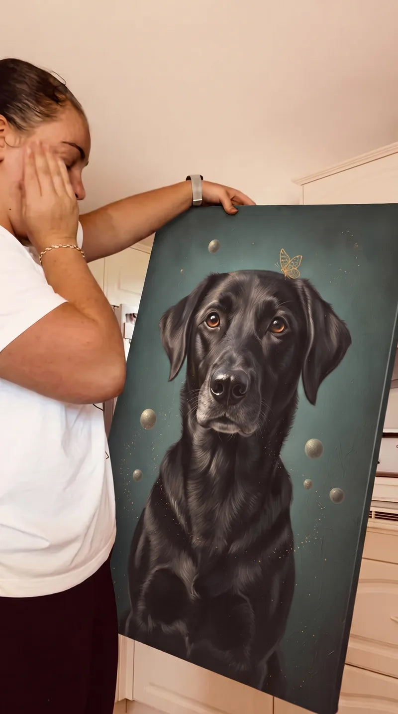 A customer wiping away a tear while holding a large canvas portrait of her black Labrador